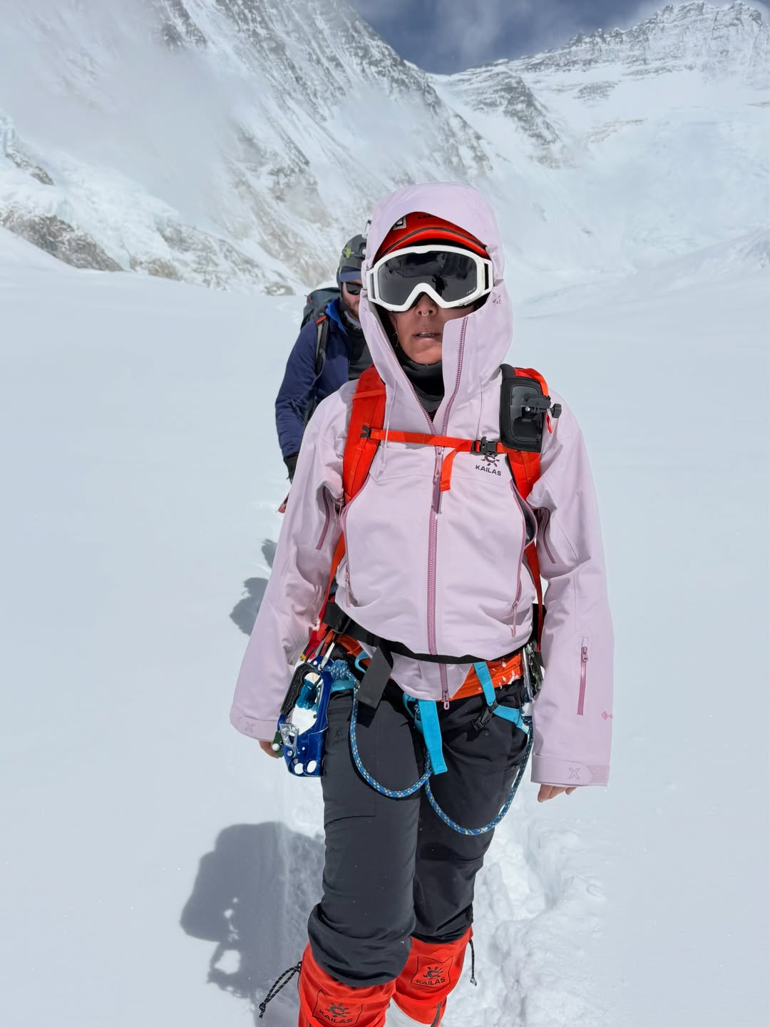 River Ahmad in climbing gear in the snow on a mountain pass