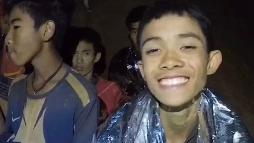 The boys trapped in a Thai cave appear to be in high spirits despite their predicament.