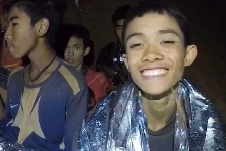 The boys trapped in a Thai cave appear to be in high spirits despite their predicament.