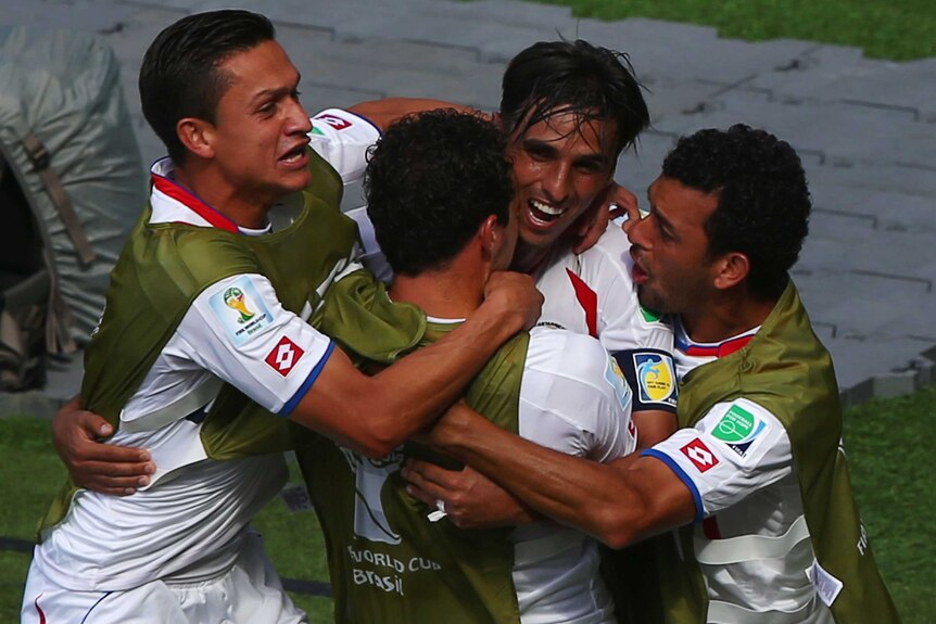 Bryan Ruiz (2nd from right) celebrates his team's first goal against Italy.