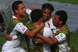 Bryan Ruiz (2nd from right) celebrates his team's first goal against Italy.