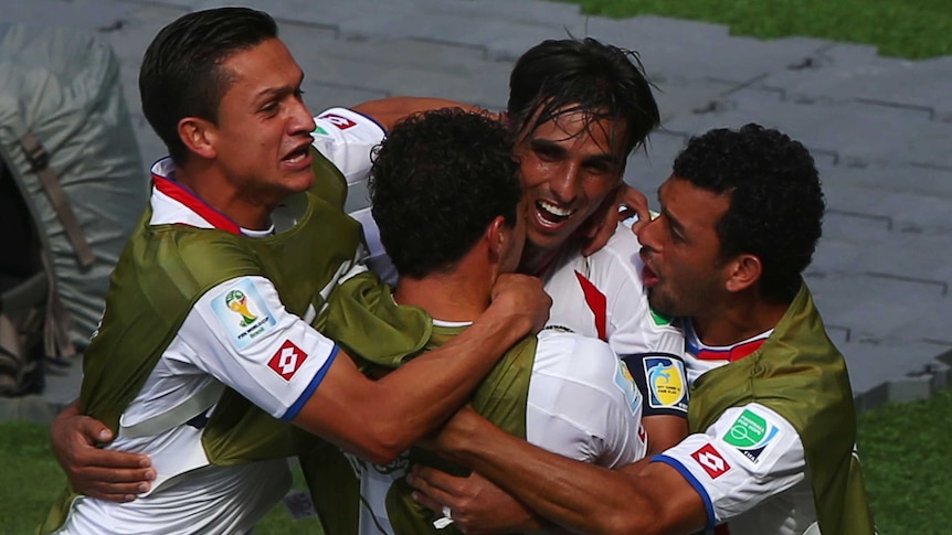 Bryan Ruiz (2nd from right) celebrates his team's first goal against Italy.