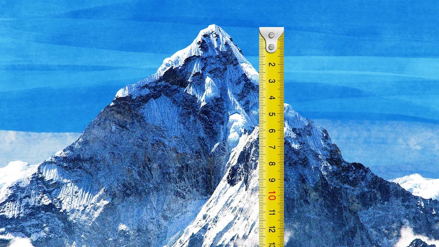 A photo of Mount Everest with a common, workshop style measuring tape extended along side it.