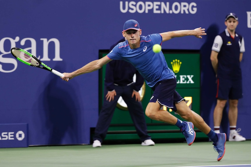 Alex de Minaur stretches for a forehand against Marin Cilic at the US Open.