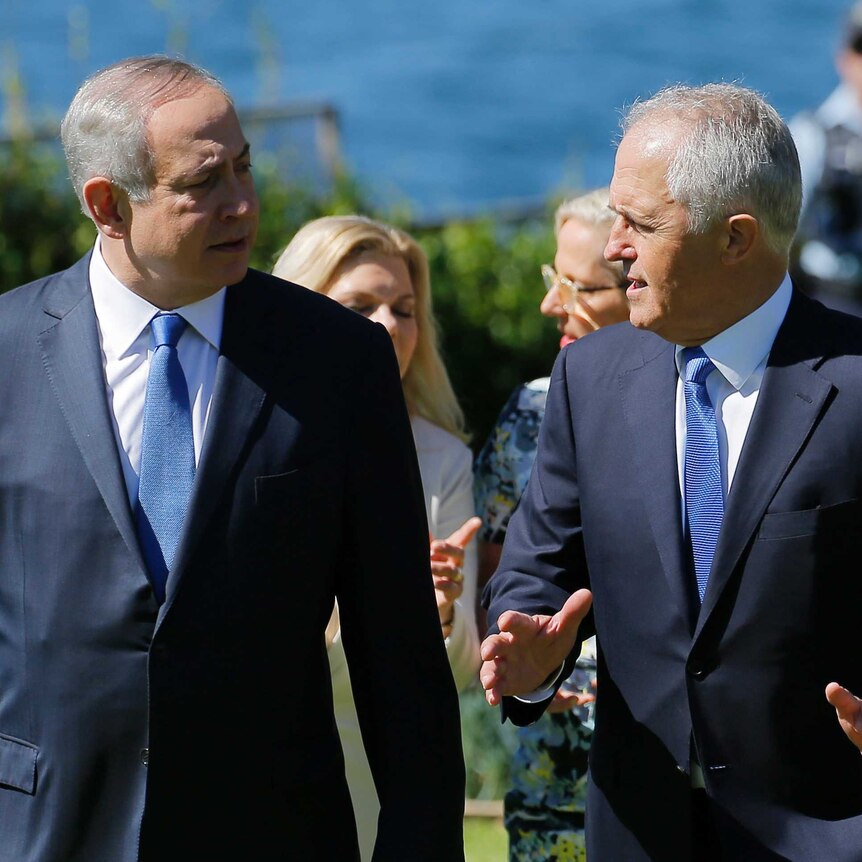 Benjamin Netanyahu and Malcolm Turnbull talk as they walk across the Admiralty House lawn in Sydney.