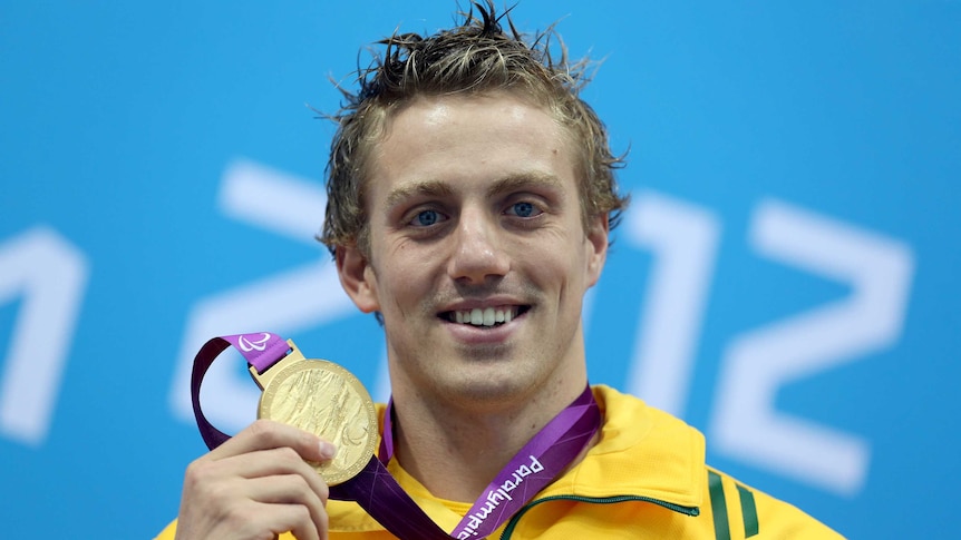 Australia's Matt Cowdrey poses with his gold medal for the S9 100m freestyle in London