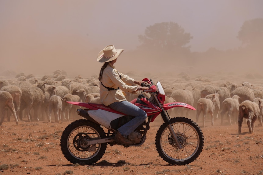 a girl on a motorbike in out Australia