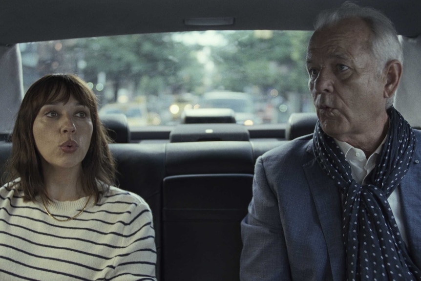 Rashida Jones and Bill Murray sit in the back of a car in the film On the Rocks