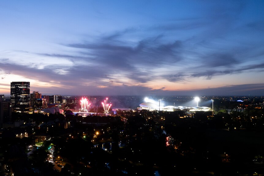 A wide aerial shot of fireworks near the Adelaide CBD at night.
