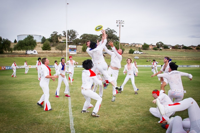 Elvises playing footy.