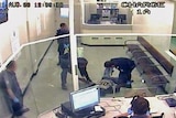 TV still of man being tasered at the East Perth lockup in 2008