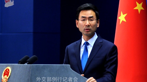 Chinese Foreign Ministry spokesman Geng Shuang speaking at a podium