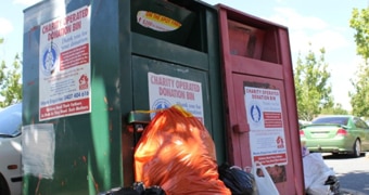 A green and a red charity bin