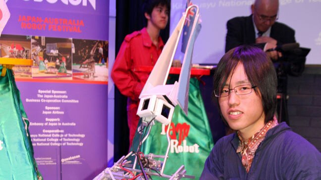 Japanese student Tomohiro Aka and his robot T-Rex