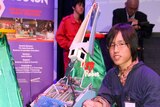 Japanese student Tomohiro Aka and his robot T-Rex