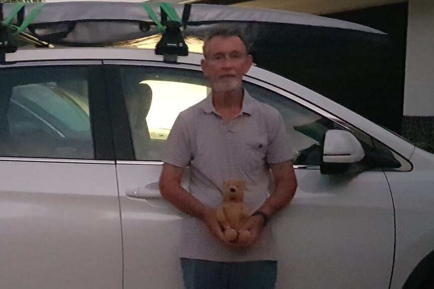 Pooh bear and Gordon Wilson post for a photo before leaving Bowen in north Queensland] 