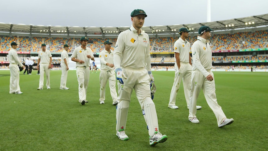 Peter Nevill walks off the Gabba turf