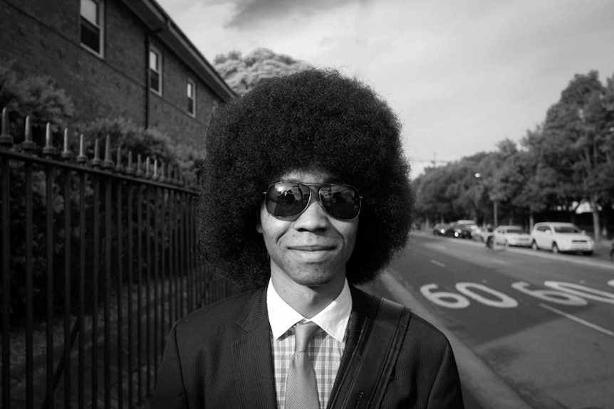 A man with an afro hairdo in Sydney.