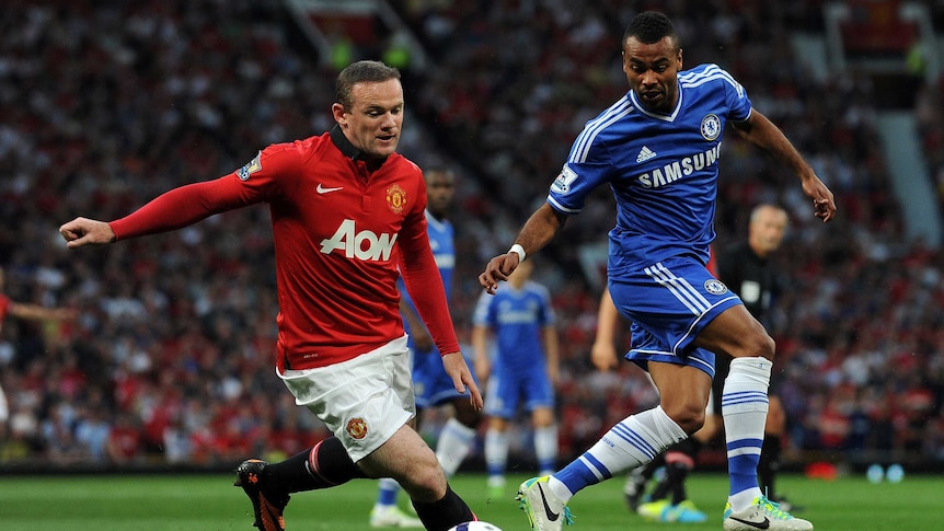 Manchester United's Wayne Rooney takes on Chelsea defender Ashley Cole