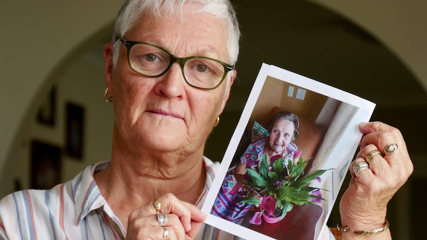 A woman hold a photo