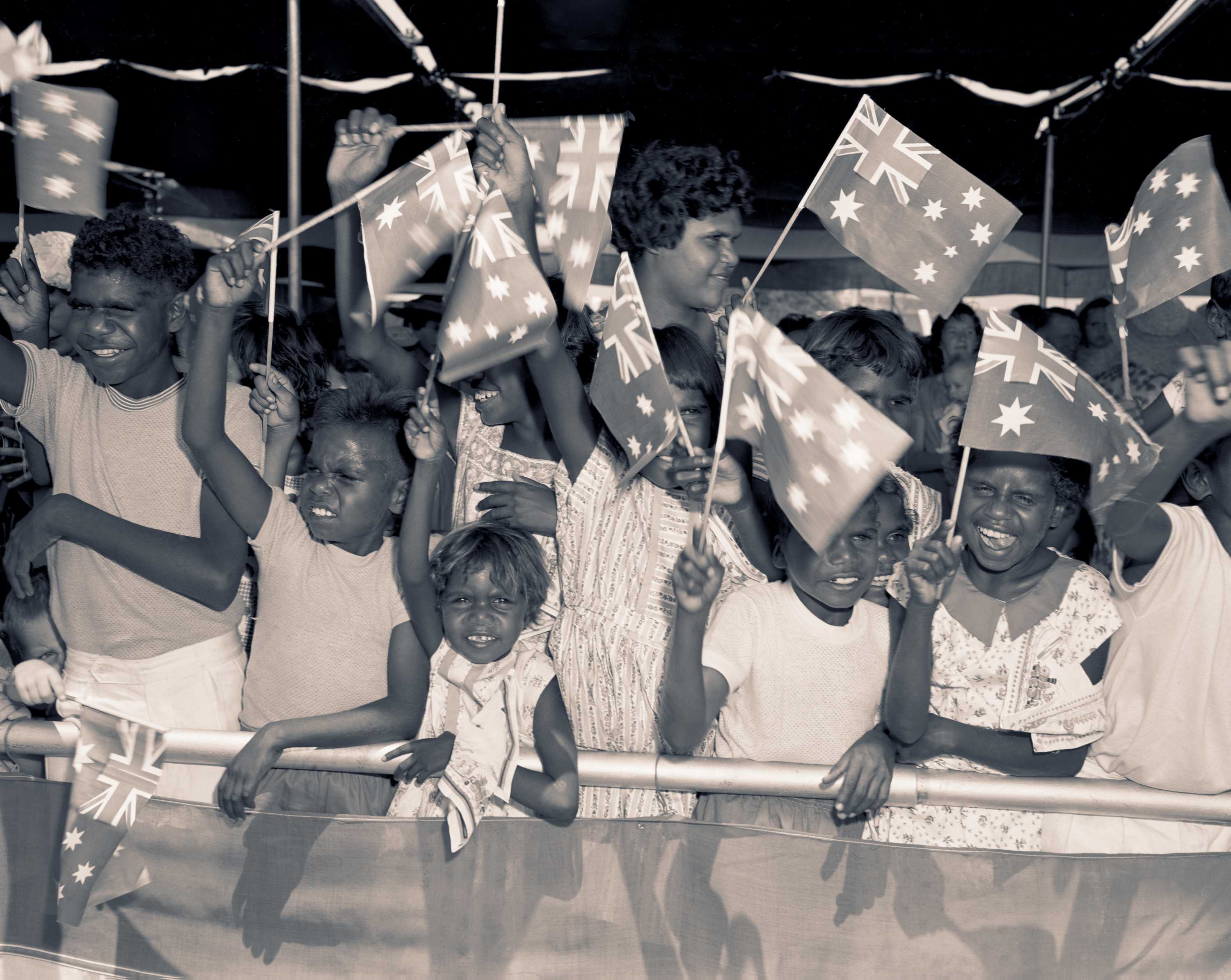 Aboriginal children wait to greet the Queen at the Alice Springs airport in 1963.