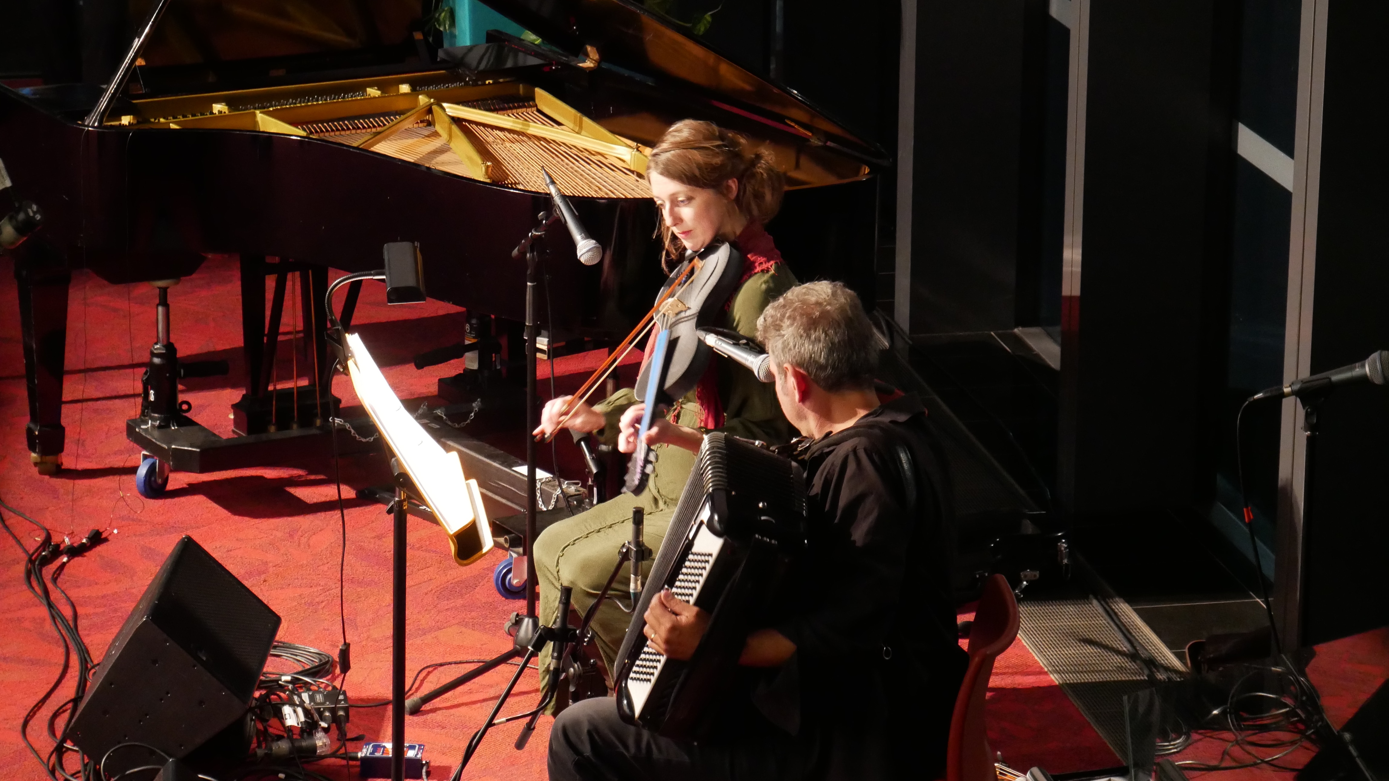 A wide shot of two people on stage