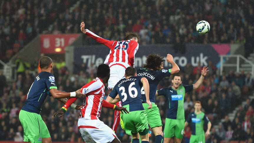 Peter Crouch scores for Stoke City against Newcastle United in the Premier League.