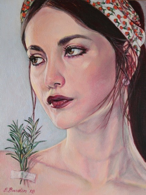A portrait of a woman wearing a headscarf.