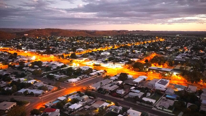 An aerial showing an outback city at night