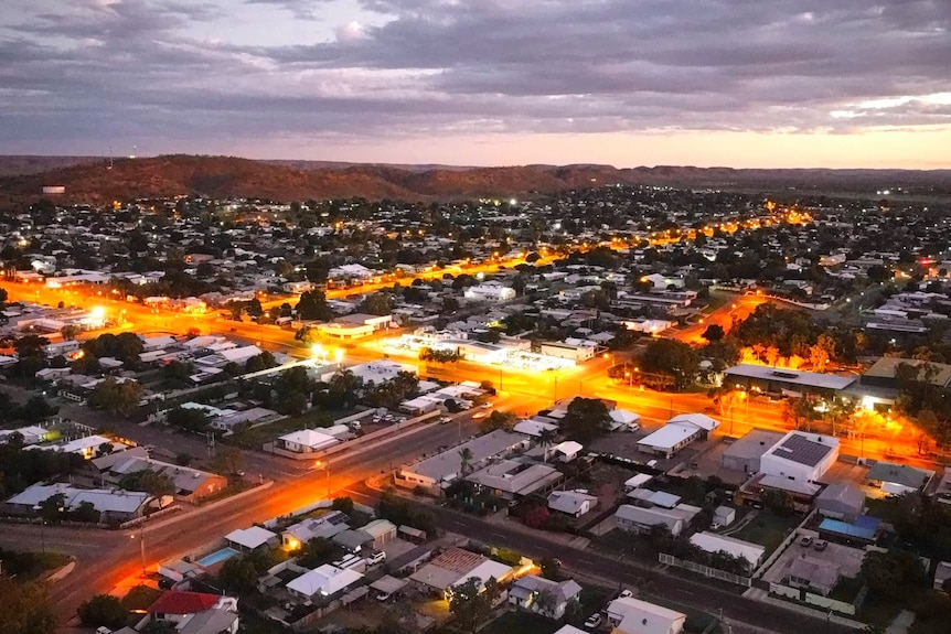 An aerial showing an outback city at night