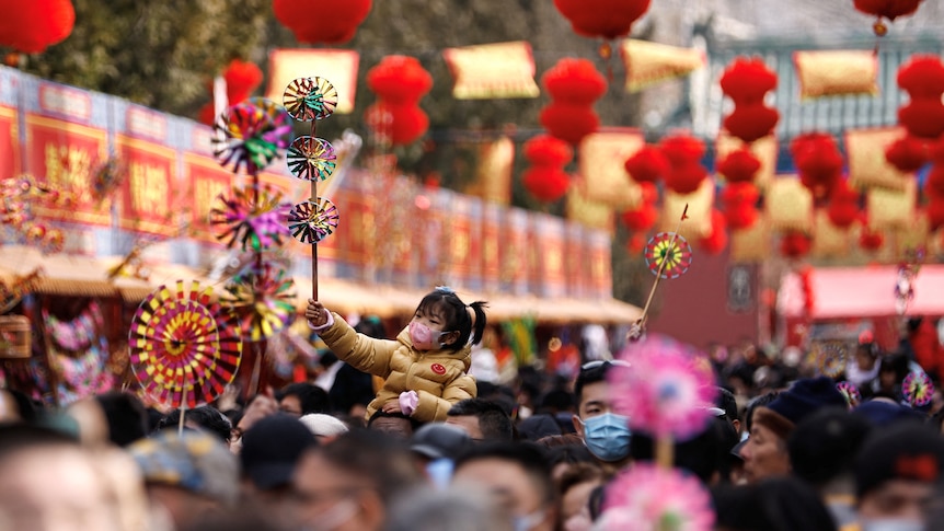 People gather at a temple fair amid Lunar New Year celebrations in Beijing, China February 11, 2024.