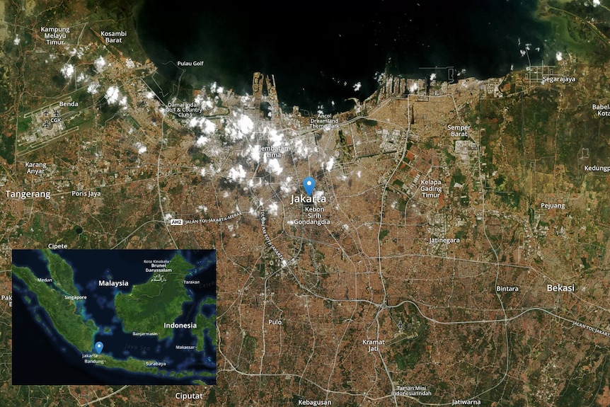 A satellite map of the Jakarta metropolitan region with a cut-out showing the location of Jakarta relation to the Indonesia.