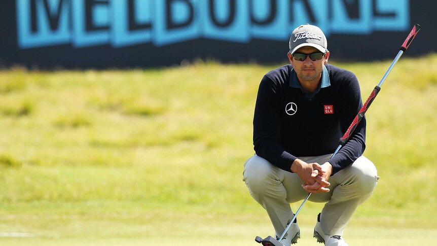 Adam Scott lines up a putt in round two of the Australian Masters.