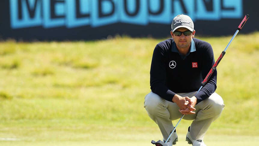 Adam Scott lines up a putt at Royal Melbourne