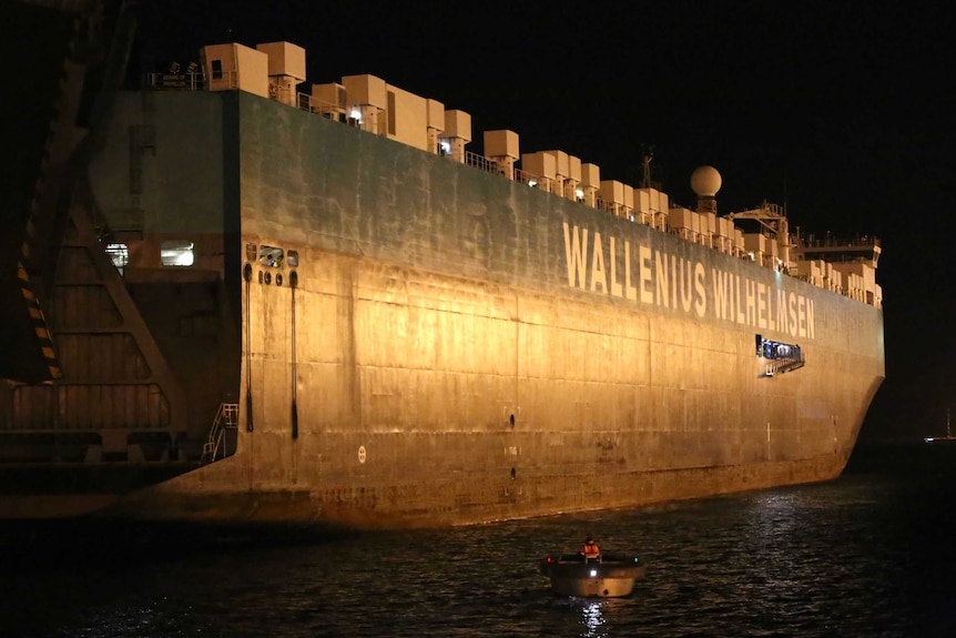 A container ship at night time.