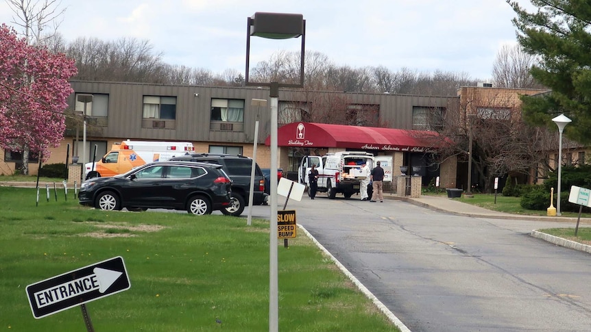 Ambulance crews are parked outside Andover Subacute and Rehabilitation Centre in Andover, New Jersey.