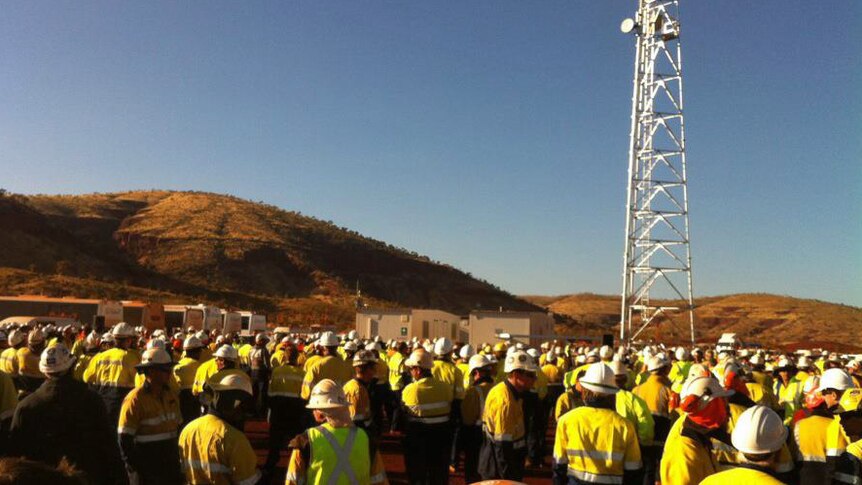 Workers gather at FMG's Solomon project