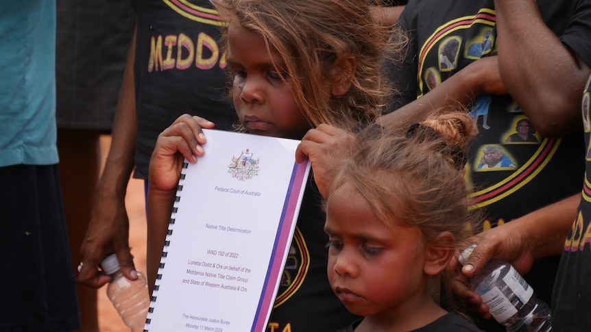 A child holding official paperwork