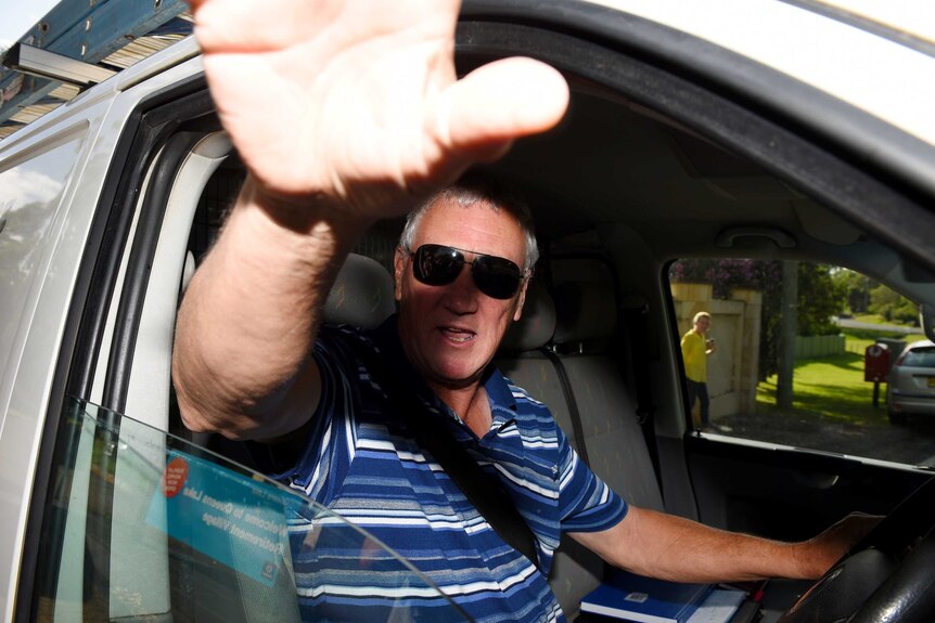 Bill Spedding is seen leaving a property in March 2015.