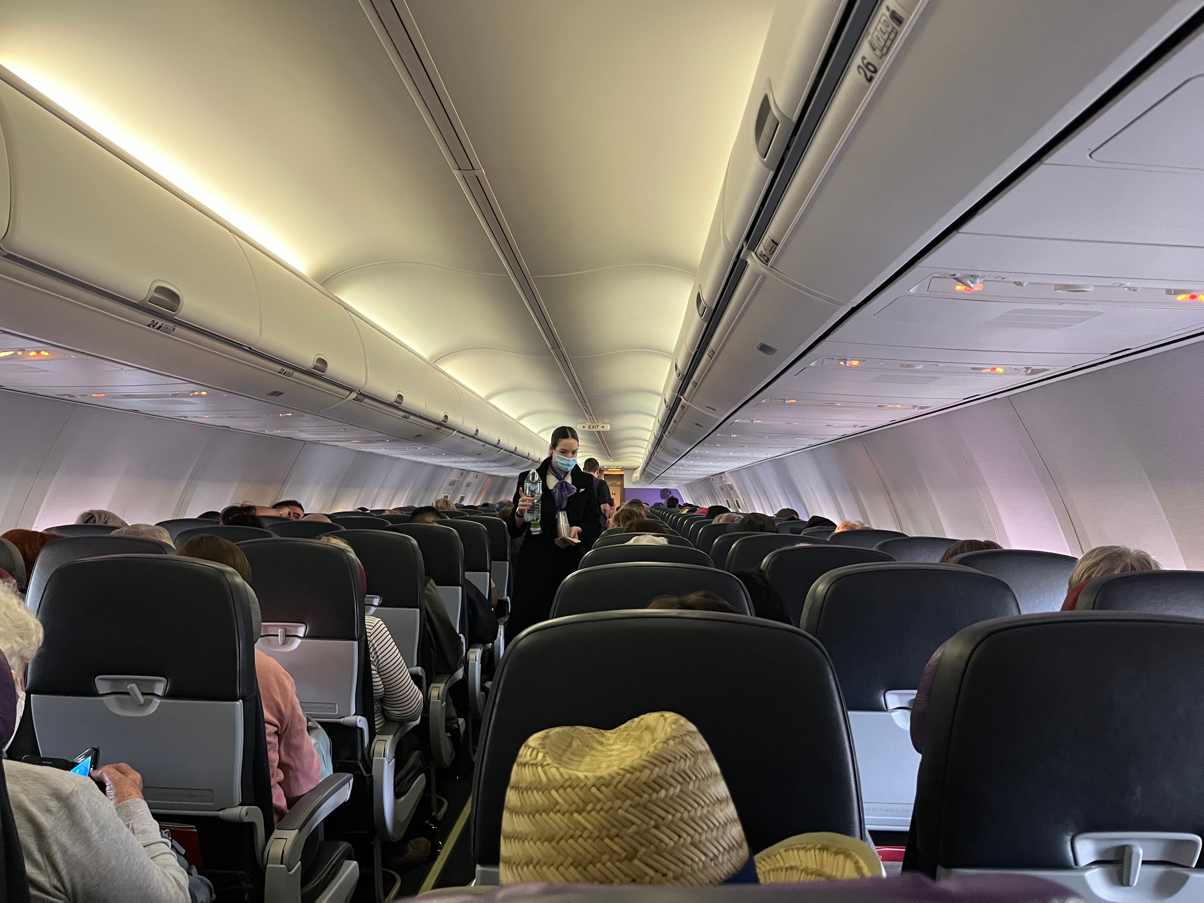 People seated on a plane. 