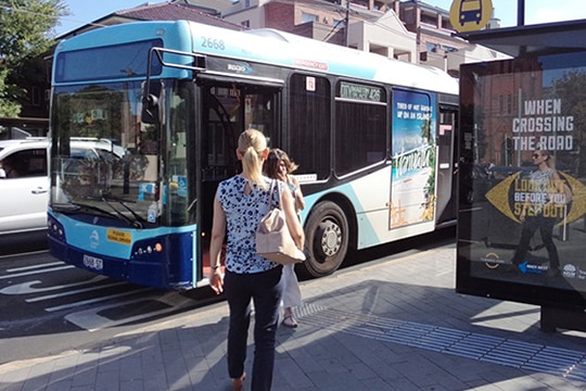 a woman about to hop on a bus