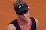 Samantha Stosur reacts during her loss to Italy's Sara Errani in the French Open