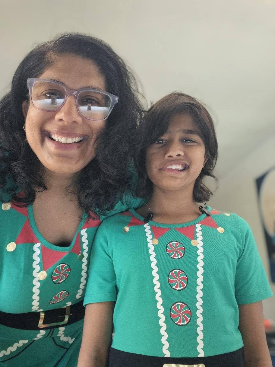 Niti and her daughter wearing green
