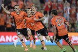 Brisbane Roar's Luke Brattan celebrates with team-mates after scoring the winner against Melbourne Victory