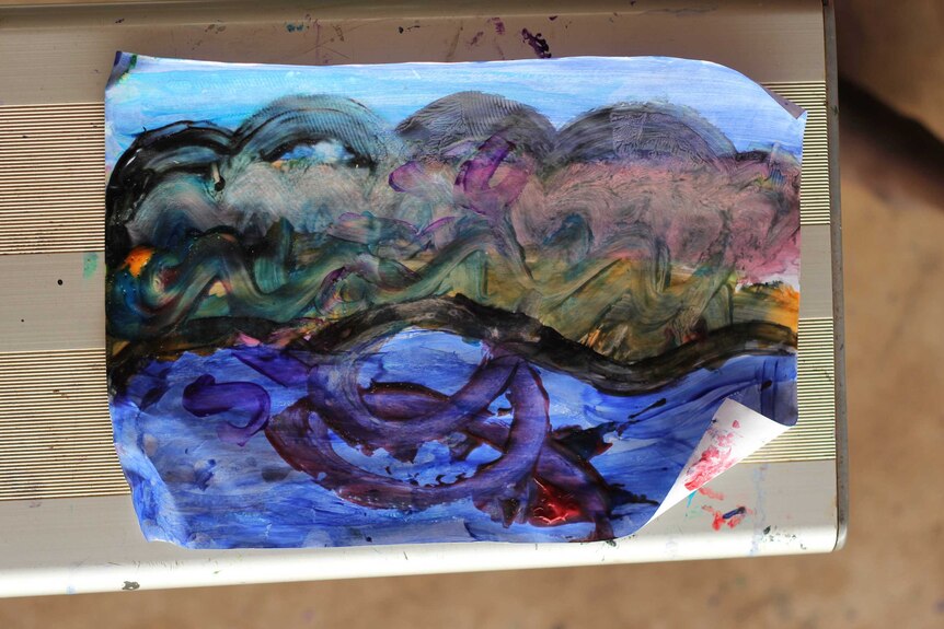A colourful painting on a piece of paper.