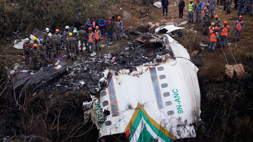 Rescuers scour the crash site of a Yeti Airlines passenger plane in Pokhara, Nepal, on Monday, January 16, 2023.