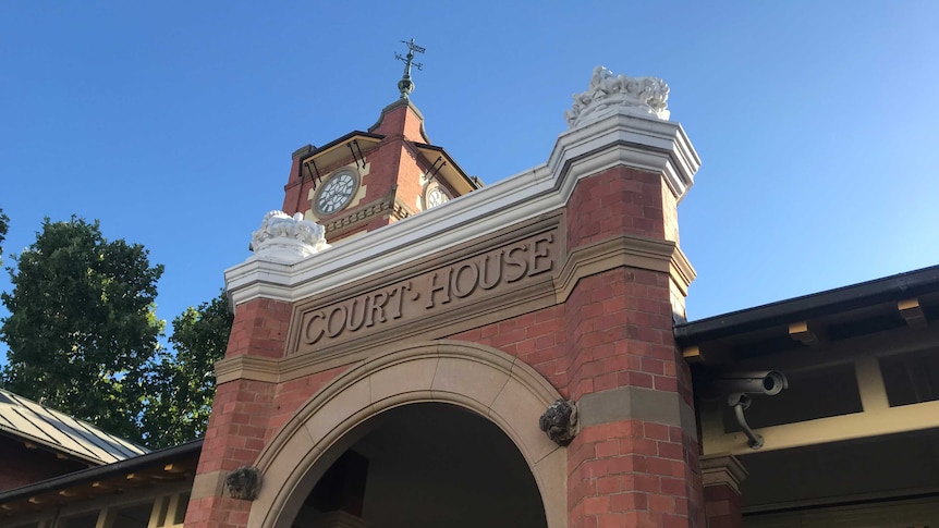 Close up of brick building with text 'court house'