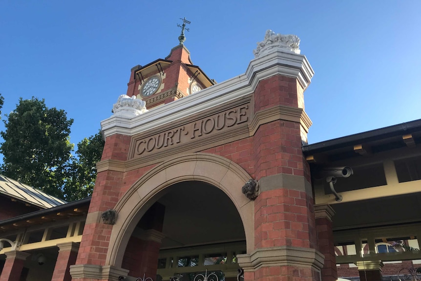 Close up of brick building with text 'court house'