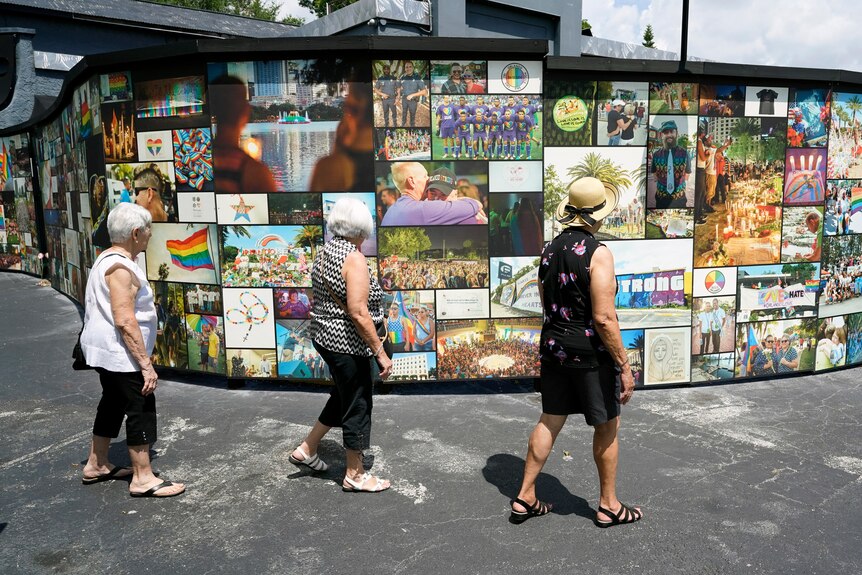 Visitors pay tribute to the outdoor display at the Pulse nightclub memorial Friday, June 11, 2021, in Orlando.