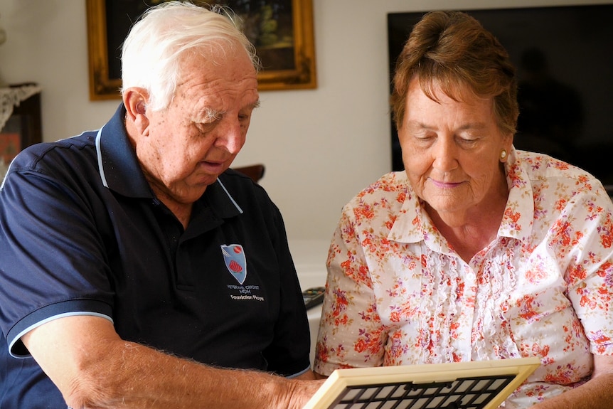 Doug and Margaret Crowell looking at photo